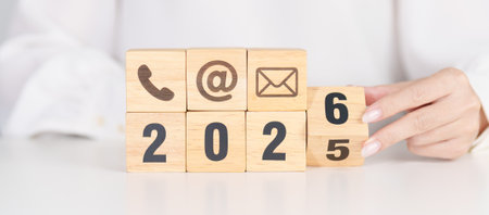 Happy New Year 2026 block for Contact Us concepts. Wood block of Email, call Phone and Website...