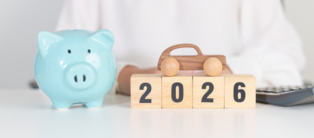 Happy New Year 2026 with car model and Coins Money stack for deposit and Automobile Tax. Money...
