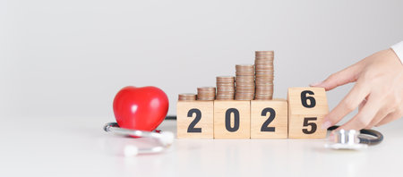 Happy New Year with doctor Stethoscope, coins stack and red heart on table. health care, Money...