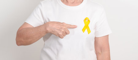 Elderly with Yellow Ribbon for concept of yellow September, Suicide prevention day, Childhood, July...