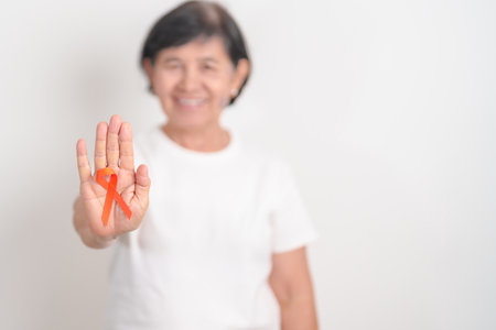 Elderly with Orange Ribbon for September Leukemia, March Kidney cancer day, Multiple Sclerosis,...