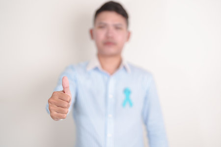 Man with blue Ribbon for concept of blue November, November Prostate Cancer Awareness month, World...