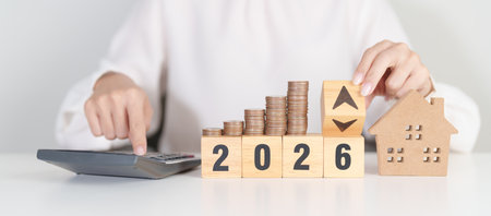 2026 New Year with percentage change to UP and Down arrow, Home model and coin stack. Real estate...