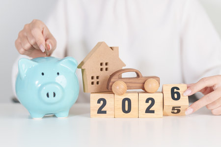 2025 end year to Happy New Year 2026 with car and Home model with coin stack. Car loan, Interest...