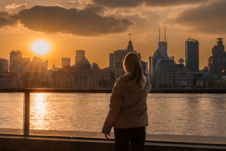 woman traveler visiting in Shanghai, China. Happy Female Tourist sightseeing Shanghai view of the...