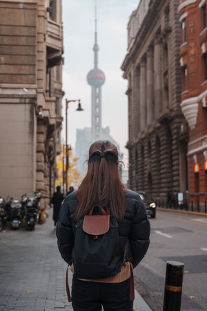 woman traveler visiting in Shanghai, China. Happy Female Tourist sightseeing Oriental Pearl Tower view in The Bund of Shanghai. landmark and popular for tourism attractions. Travel and Vacationの写真素材