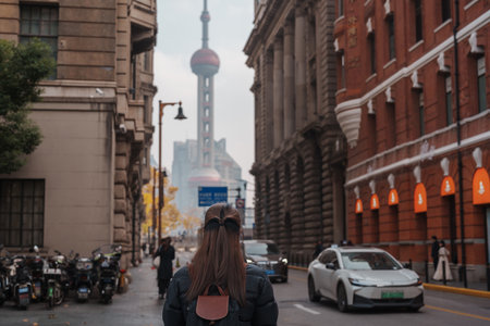 woman traveler visiting in Shanghai, China. Happy Female Tourist sightseeing Oriental Pearl Tower...