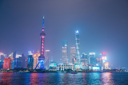 Cityscape view of Shanghai city at night. Skyscraper of Lujiazui in Pudong, view from The Bund of...