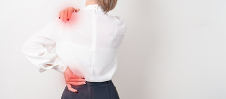 Business woman having back body ache for concepts of Back Muscle Strain, Piriformis Syndrome, Low...