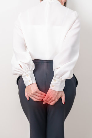 Woman having Anal symptoms pain for Hemorrhoids disease, Constipation, Anal cancer awareness month,...