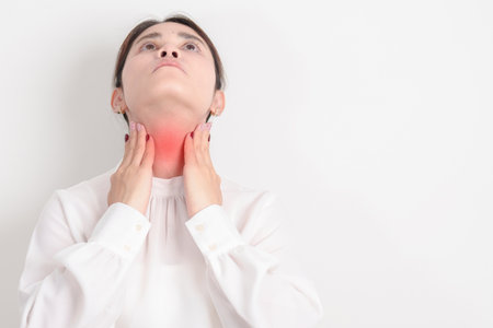 business Woman checking Thyroid gland disease. Hand holding Neck pain and Sore Throat....