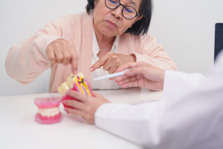 Elderly Patient consulting Dentist to Tooth disease, Senior Health Medical Diagnosis. Anatomy teeth...