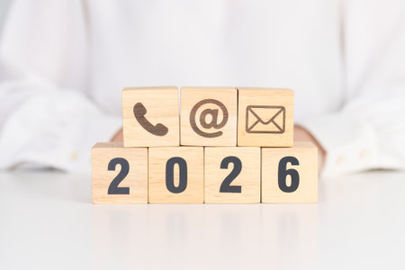 Happy New Year 2026 block for Contact Us concepts. Wood block of Email, call Phone and Website...
