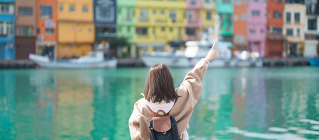 woman traveler visiting in Taiwan, female Tourist with backpack sightseeing at Keelung, Colorful...