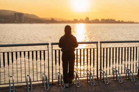woman traveler traveling in Taiwan, female Tourist sightseeing at Tamsui Old Street in sunset....