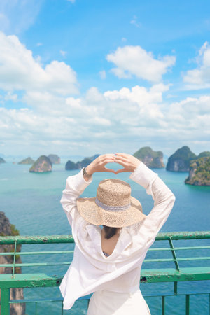 Woman tourist traveling in Krabi, Thailand. happy traveller enjoy and sightseeing view at koh Hong island viewpoint. summer trip, destination, Southeast Asia Travel, vacation and holiday conceptの写真素材