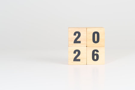 2026 year block on table. goal, Resolution, strategy, plan, start, budget, mission, action, motivation and New Year conceptsの写真素材