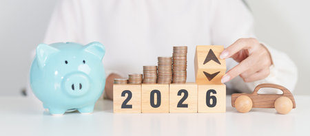 2026 New Year with percentage change to UP and Down arrow, car model and coin stack. Car loan, Interest rate, Insurance, Financial, vehicle Repair, Automobile Tax, mortgage and Maintenanceの写真素材