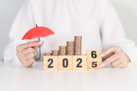 2025 end year to Happy New Year 2026 with hand holding red umbrella and money stack growing....