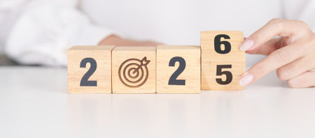 2025 year change to 2026 year block with dartboard icon. Goal, Target, Resolution, strategy, plan,...