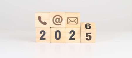 Happy New Year 2026 block for Contact Us concepts. Wood block of Email, call Phone and Website...