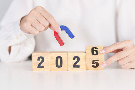 hand holding magnet over 2026 Year block. Human resource management, Recruitment, Teamwork, strategy and leadership Conceptsの写真素材