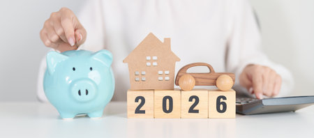 Happy New Year 2026 with car and Home model with coin stack. Car loan, Interest rate, real estate,...