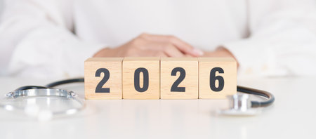 Happy New Year 2026 with Stethoscope of doctor and heart shape on table. health care, Insurance, Wellness and medical conceptsの写真素材