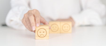 Woman show Unhappy Sad face block, Mental health Assessment, Psychology, Health Wellness, Feedback, Customer Review, Experience, Satisfaction Survey, Negative Thinking and World Mental Health dayの写真素材