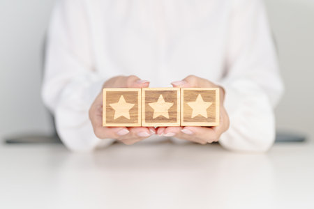 hand show Star block. Customer choose rating for user reviews. Service rating, ranking, customer review, satisfaction, evaluation and feedback conceptの写真素材