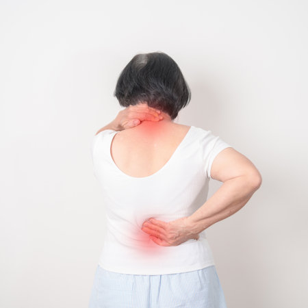 Elderly woman having back body ache for concepts of Back Muscle Strain, Piriformis Syndrome, Low...