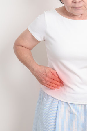 Elderly woman having side and Back Waist pain for Kidney disease, Urinary system and Stones, world...