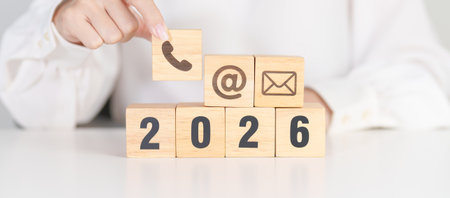 Happy New Year 2026 block for Contact Us concepts. Wood block of Email, call Phone and Website...
