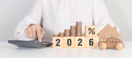 2026 New Year with percentage change to UP and Down arrow, car and Home model with coin stack. Car...