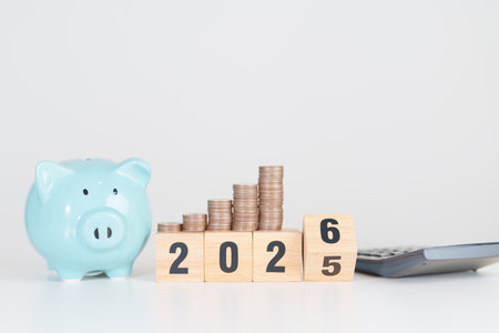 2025 end year to Happy New Year 2026 with piggy bank. Resolution, Goals, Plan, Action, Money Saving, Retirement fund, Pension, Investment and Financial conceptsの写真素材