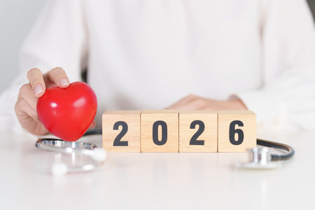 Happy New Year 2026 with Stethoscope of doctor and heart shape on table. health care, Insurance, Wellness and medical conceptsの写真素材