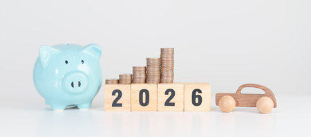 Happy New Year 2026 with car model and Coins Money stack for deposit and Automobile Tax. Money...