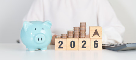 2026 New year with change to UP and Down arrow with coin stack. Interest rate, GDP, stocks market,...