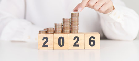 Happy New Year 2026 with Coins stack. Money, Budget, tax, investment, financial, savings and New...