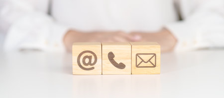 Contact Us concepts. Wood block of Email, call Phone and Website Address sign. For Customer support hotline, business Marketing, Corporate, communication and Advertisingの写真素材