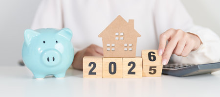 Happy New Year 2026 with house model and Coins stack. real estate, Home loan, tax, investment,...
