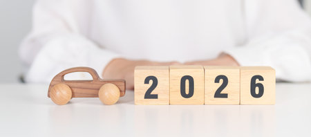 Happy New Year 2026 with Car model on table. Automobile Tax, Car Insurance, Financial, vehicle...