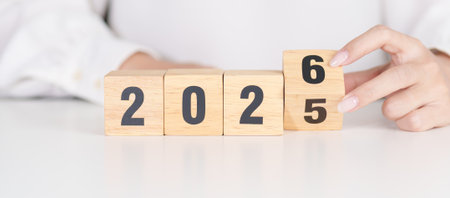 2025 change to 2026 year block on table. goal, Resolution, strategy, plan, start, budget, mission, action, motivation and New Year conceptsの写真素材