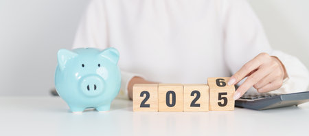 2025 end year to Happy New Year 2026 with piggy bank. Resolution, Goals, Plan, Action, Money Saving, Retirement fund, Pension, Investment and Financial conceptsの写真素材