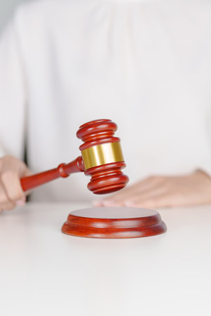 Woman Hand hold judge gavel. Law, lawyer, judgment, justice and bidding concept