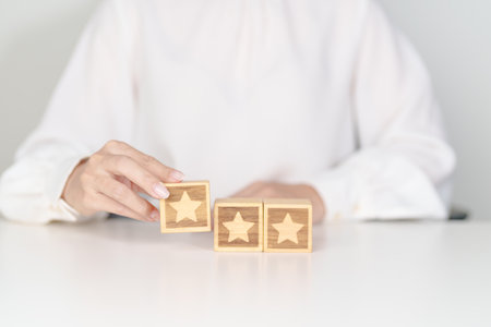 hand show Star block. Customer choose rating for user reviews. Service rating, ranking, customer review, satisfaction, evaluation and feedback conceptの写真素材