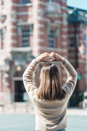 Woman tourist sightseeing at Bank of Iwate Red Brick Building, happy traveler travel in Morioka city, Iwate prefecture, Japan. famous Landmark Travel and Vacation destinationの写真素材