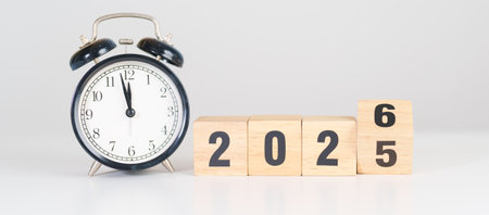 2025 end year to Happy New Year 2026 with vintage alarm clock. Christmas, New Start, Resolution,...