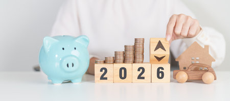 2026 New Year with percentage change to UP and Down arrow, car and Home model with coin stack. Car...