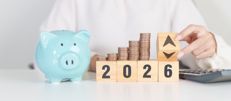 2026 New year with change to UP and Down arrow with coin stack. Interest rate, GDP, stocks market, financial, deflation and Inflation, mortgage, debt, Loan and Economic Recessionの写真素材